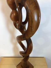 Kissing couple abstract wood sculpture